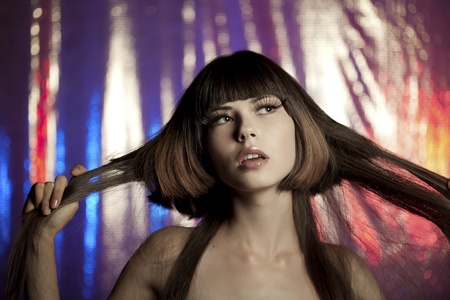 Image of a beautiful girl in the club at the discoの写真素材