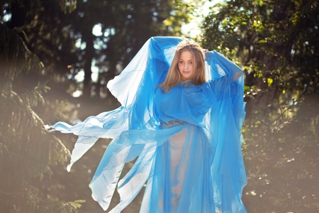 Beautiful woman against the background of nature.の写真素材