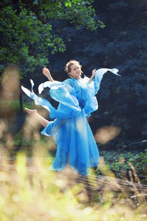 Beautiful woman against the background of nature.の写真素材