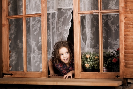 Beautiful little girl, a child on the farmの写真素材