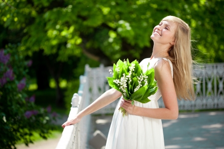 Portrait of a young woman smiling in a park, Outdoors の写真素材