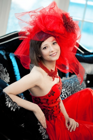 Woman in red at the luxurious interiorの写真素材