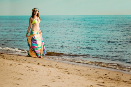 Luxurious beautiful fashionable woman on the beach at sun
の写真素材