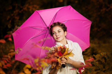Woman in the autumn parkの写真素材