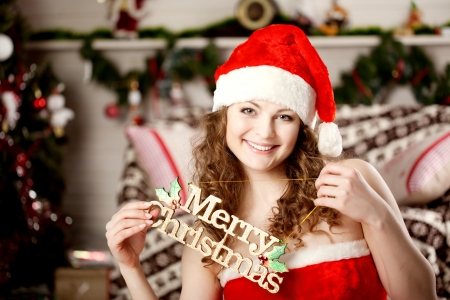 Beautiful christmas woman in santa suitの写真素材