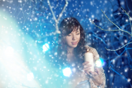 Beauty young woman in winter forestの写真素材