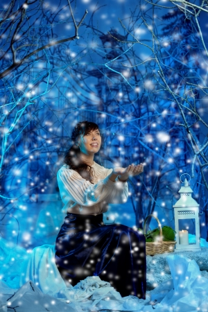 Beauty young woman in winter forestの写真素材