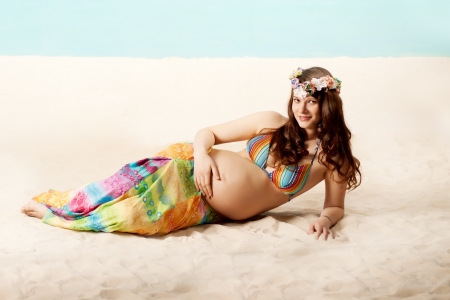 Beautiful pregnant woman on the beachの写真素材