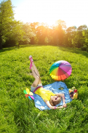 Happiness young beauty woman at a picnic in the parkの写真素材