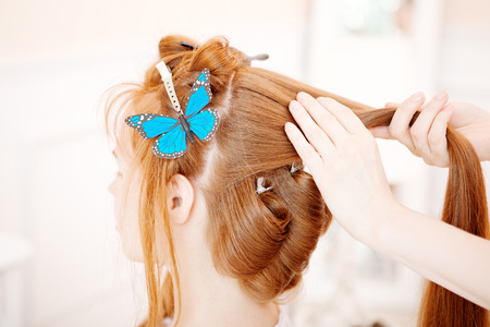 Hair stylist makes the bride before the weddingの写真素材