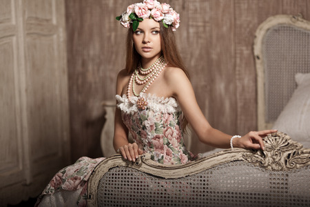 Luxury young smiling beauty woman in vintage dress in elegant interior 