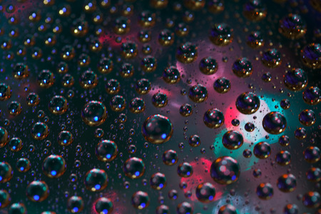 Abstract background texture drops of water and art light on glass. Creative space designの写真素材