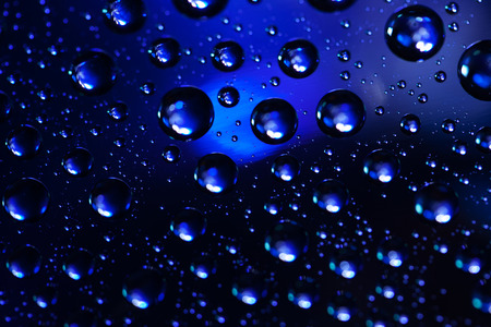 Abstract background texture drops of water and art light on glass. Creative space designの写真素材
