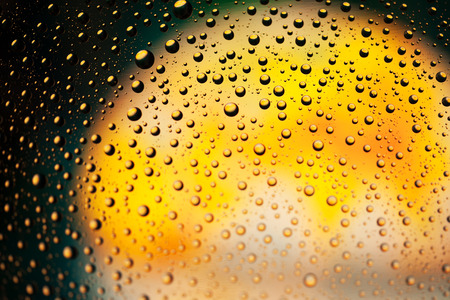 Abstract background texture drops of water and art light on glass. Creative space designの写真素材