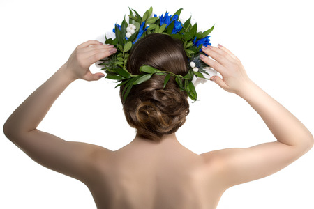 Beautiful evening hairstyle, view from the back, behind. Woman model with luxurious hair. Girl with...