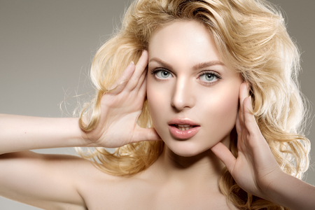 Beauty face woman. Girl healthy model in spa salon. Cream treatment products. Facial skin terapyの写真素材