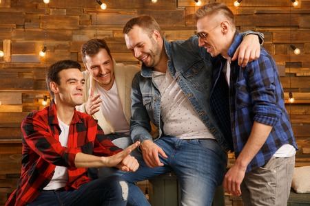 Four men at a partyの写真素材