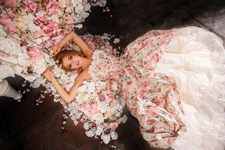Luxury model in vintage style. Beautiful woman with a stunning hairstyle and make-up in a rococo dress. Girl at the Masquerade Spring Ballの写真素材