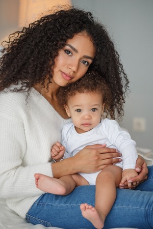 Love of a mother and baby. Family at home. Lifestyleの写真素材