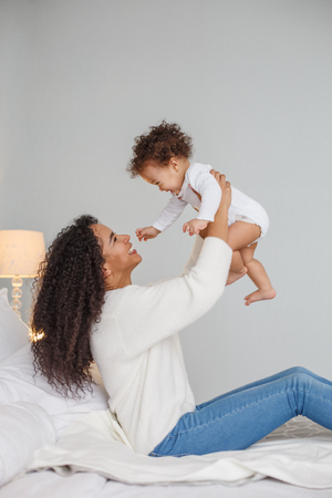 Love of a mother and baby. Family at home. Lifestyleの写真素材