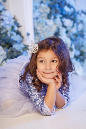 Cute little girl with flowersの写真素材