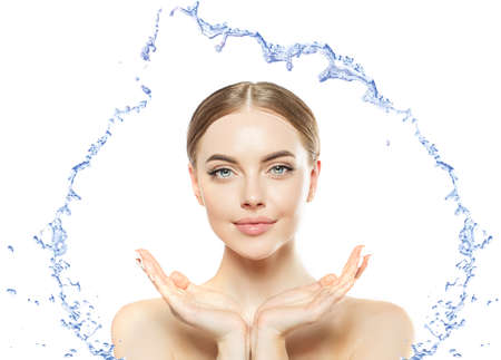Woman and water. Girl and Water splashes on a white background. Pretty Model with fresh drink.の写真素材
