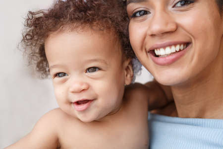 Love of a mother and baby. Son and mom. Family in the house. Lifestyleの写真素材