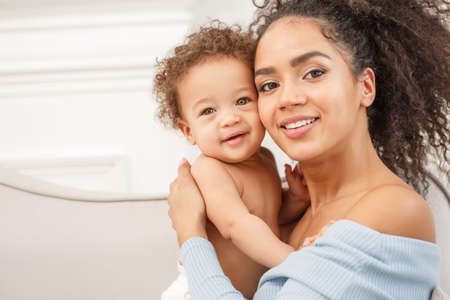 Love of a mother and baby. Son and mom. Family in the house. Lifestyleの写真素材