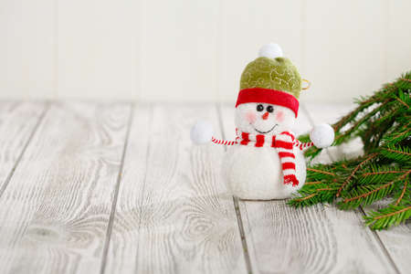 Snowman next to the New Year's tree. Snowman celebrate Christmas. good new year spiritの写真素材