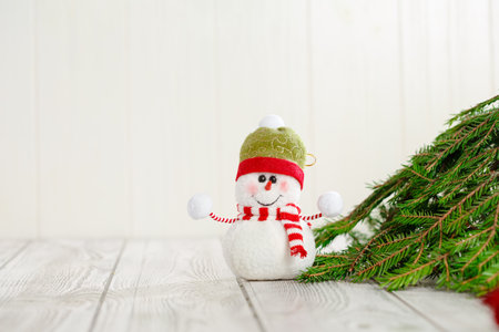 Snowman next to the New Year's tree. Snowman celebrate Christmas. good new year spiritの写真素材