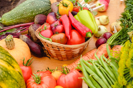 Harvest vegetables on the ground. Potatoes, carrots, beets, peppers, tomatoes, cucumbers, beans,...