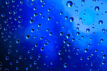 Abstract background about water or space. Multicolored stylish drops. Unusual splashes. It looks like the universe, planets and stars.の写真素材