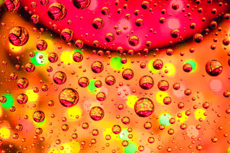 Abstract background about water or space. Multicolored stylish drops. Unusual splashes. It looks like the universe, planets and stars.の写真素材