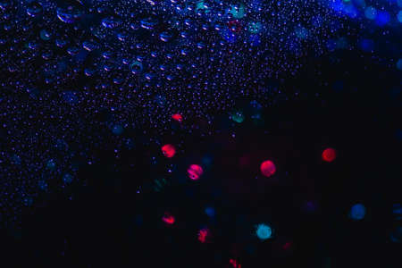 Abstract background about water or space. Multicolored stylish drops. Unusual splashes. It looks like the universe, planets and stars.の写真素材
