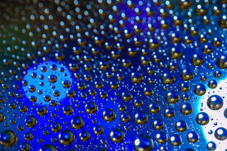 Abstract background about water or space. Multicolored stylish drops. Unusual splashes. It looks like the universe, planets and stars.の写真素材
