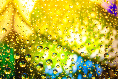 Abstract background about water or space. Multicolored stylish drops. Unusual splashes. It looks like the universe, planets and stars.の写真素材