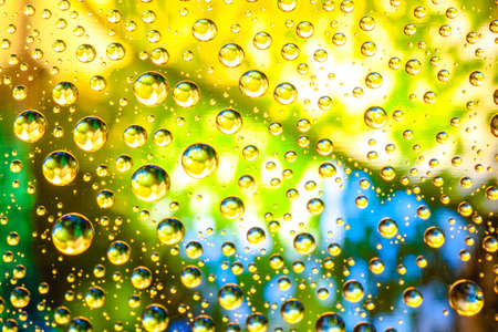Abstract background about water or space. Multicolored stylish drops. Unusual splashes. It looks like the universe, planets and stars.の写真素材