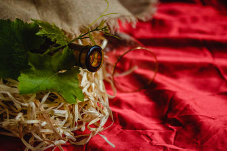Wine bottle on a wooden background. Winemaking, sommelier.の写真素材