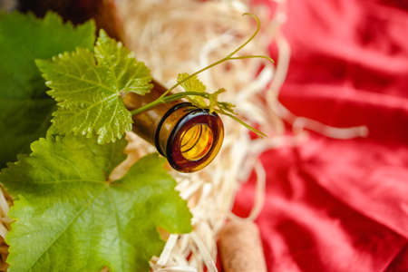 Wine bottle on a wooden background. Winemaking, sommelier.の写真素材