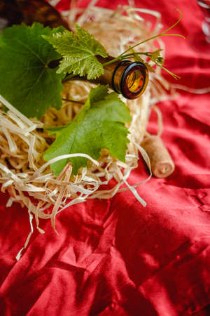 Wine bottle on a wooden background. Winemaking, sommelier.の写真素材
