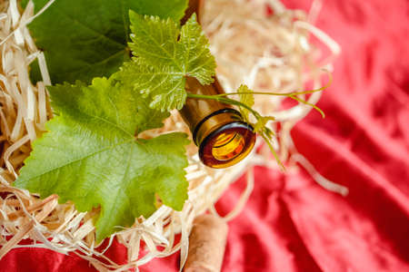 Wine bottle on a wooden background. Winemaking, sommelier.の写真素材