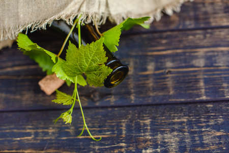Wine bottle on a wooden background. Winemaking, sommelier.の写真素材