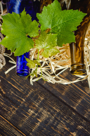 Wine bottle on a wooden background. Winemaking, sommelier.の写真素材