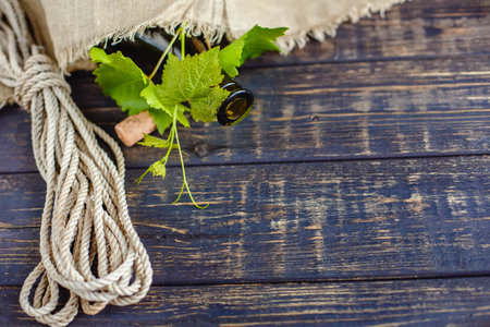 Wine bottle on a wooden background. Winemaking, sommelier.の写真素材