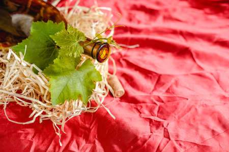 Wine bottle on a wooden background. Winemaking, sommelier.の写真素材