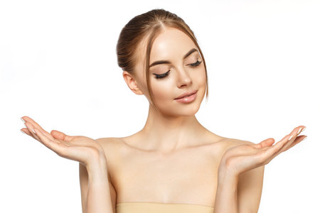 Beauty young woman with clean glowing fresh Close-up Skin on face. Beautiful elegance Girl facial treatment. Lady with perfect smooth skin. Concept of natural beauty, skin care, spa, cosmetology, cosmetics.の写真素材