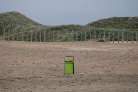 Waste bin on the beachの写真素材