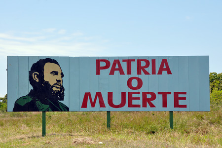 Cuban road advertising board stating patriotism or death