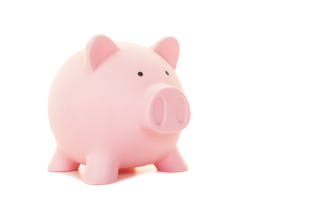 Classic pink piggy bank isolated on a white backgroundの写真素材