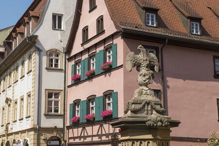 Bamberg, Germany - July 14, 2019; Old half timbered houses and an eagle statue in the center of the city of Bamberg, Germanyのeditorial素材